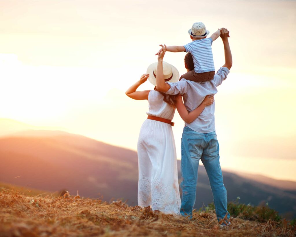 Family enjoying a sunset together